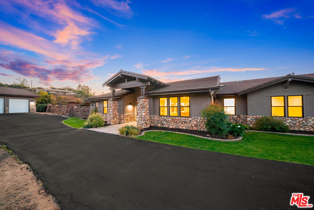 32070 Vía Vera Bonsall, CA 92003 - Photo 2 of 75 a front view of a house with garden