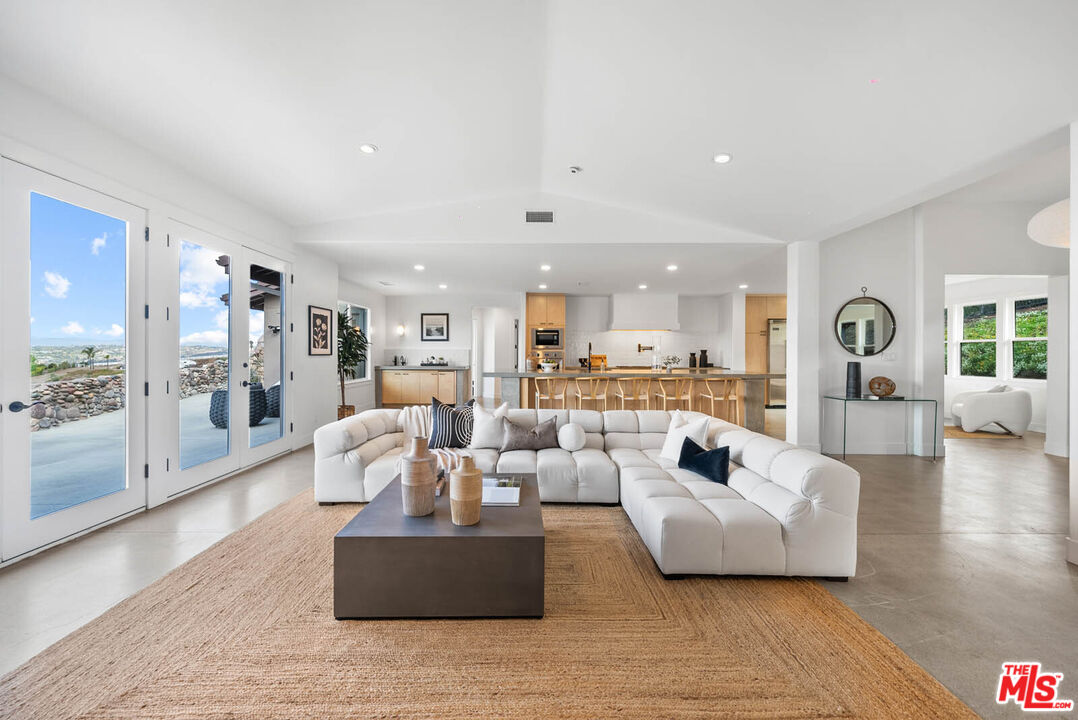 32070 Vía Vera Bonsall, CA 92003 - Photo 21 of 75 a living room with furniture and a wooden floor