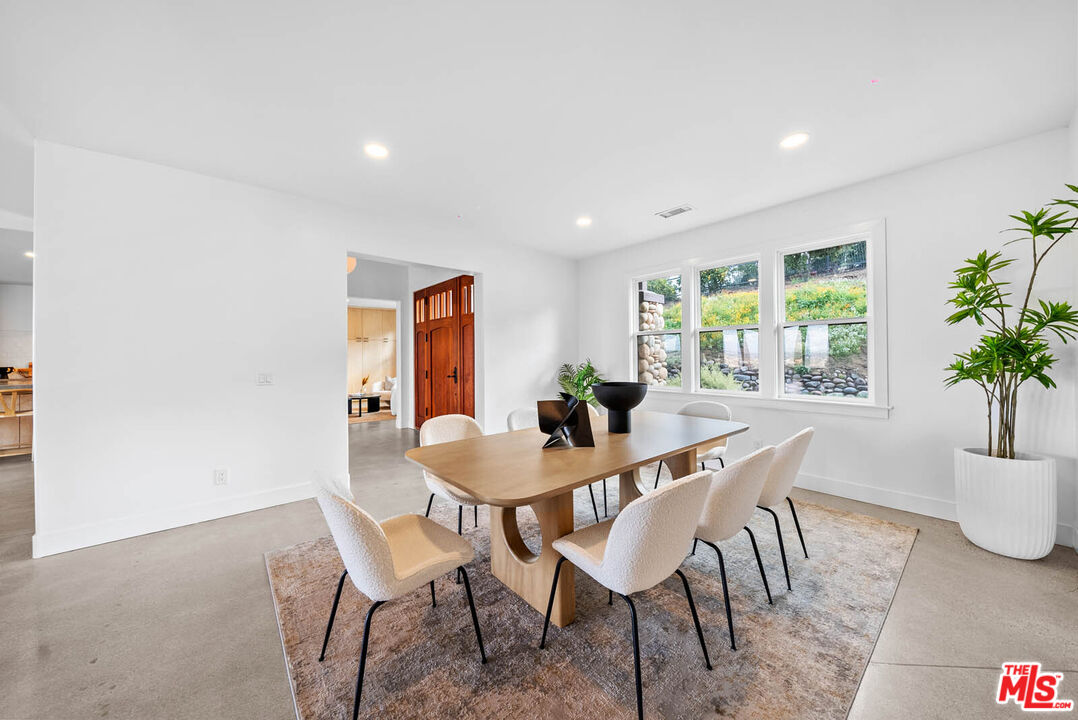 32070 Vía Vera Bonsall, CA 92003 - Photo 24 of 75 a dining room with furniture and window