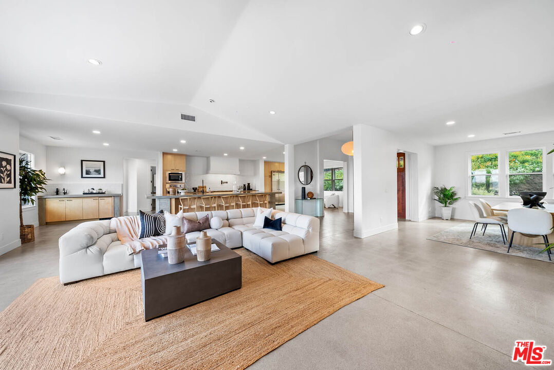 32070 Vía Vera Bonsall, CA 92003 - Photo 26 of 75 a living room with furniture and a wooden floor