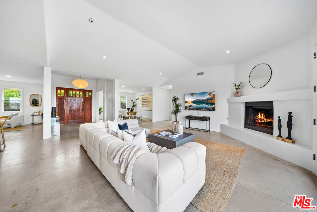 32070 Vía Vera Bonsall, CA 92003 - Photo 28 of 75 a living room with furniture and a fireplace