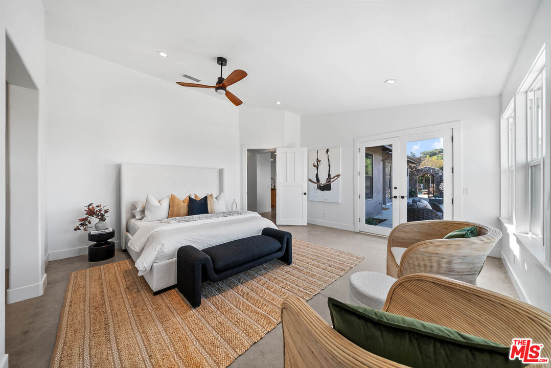 32070 Vía Vera Bonsall, CA 92003 - Photo 31 of 75 a bedroom with furniture and a wooden floor