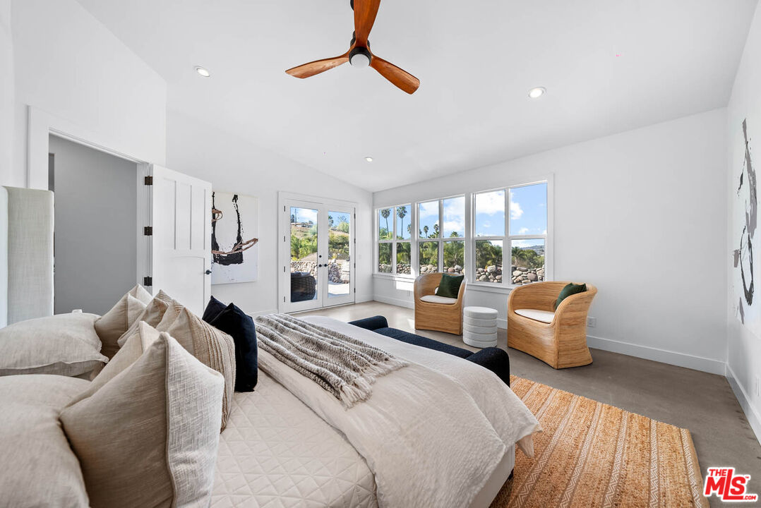 32070 Vía Vera Bonsall, CA 92003 - Photo 34 of 75 a bedroom with furniture and a large window