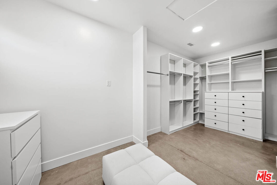 32070 Vía Vera Bonsall, CA 92003 - Photo 40 of 75 a view of walk in closet with empty racks