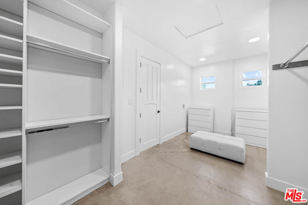 32070 Vía Vera Bonsall, CA 92003 - Photo 41 of 75 a spacious bedroom with a bed and a window