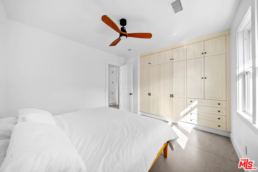 32070 Vía Vera Bonsall, CA 92003 - Photo 48 of 75 a bedroom with a bed and a ceiling fan