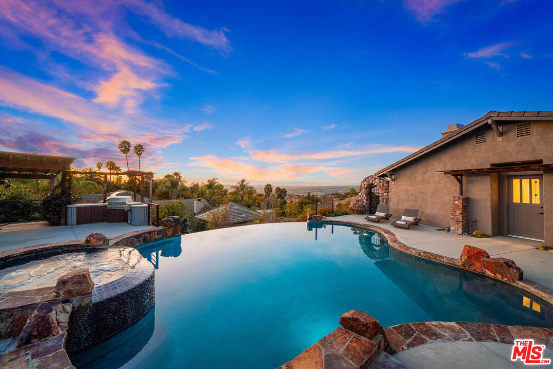 32070 Vía Vera Bonsall, CA 92003 - Photo 56 of 75 a view of a swimming pool and lounge chair