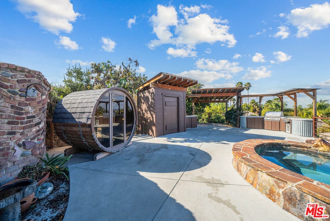 32070 Vía Vera Bonsall, CA 92003 - Photo 58 of 75 a view of a house with a yard