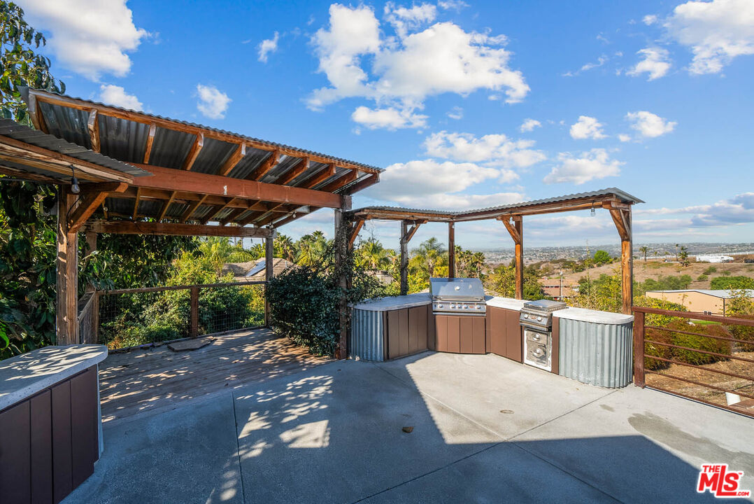 32070 Vía Vera Bonsall, CA 92003 - Photo 60 of 75 a view of a patio with a table and chairs
