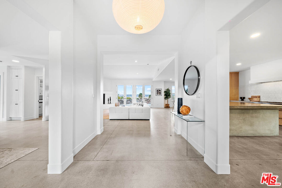 32070 Vía Vera Bonsall, CA 92003 - Photo 6 of 75 a view of living room and kitchen