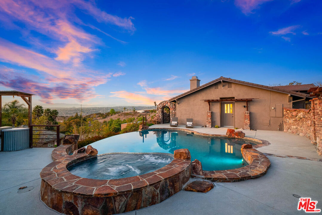 32070 Vía Vera Bonsall, CA 92003 - Photo 66 of 75 a view of a swimming pool with a patio