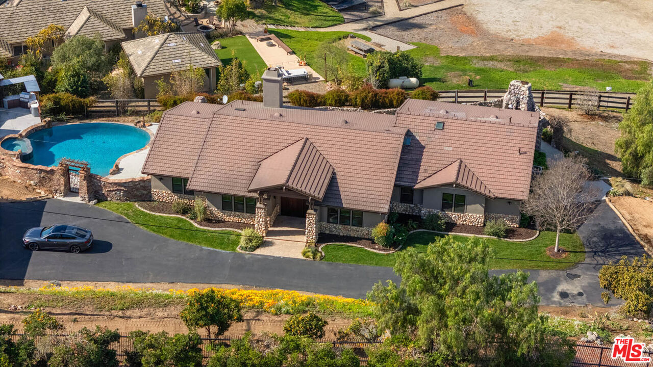 32070 Vía Vera Bonsall, CA 92003 - Photo 69 of 75 an aerial view of a house with swimming pool