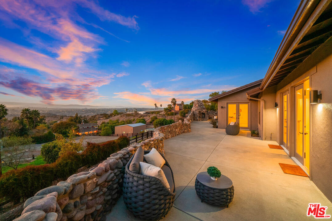 32070 Vía Vera Bonsall, CA 92003 - Photo 75 of 75 a view of a terrace with couches and sky view