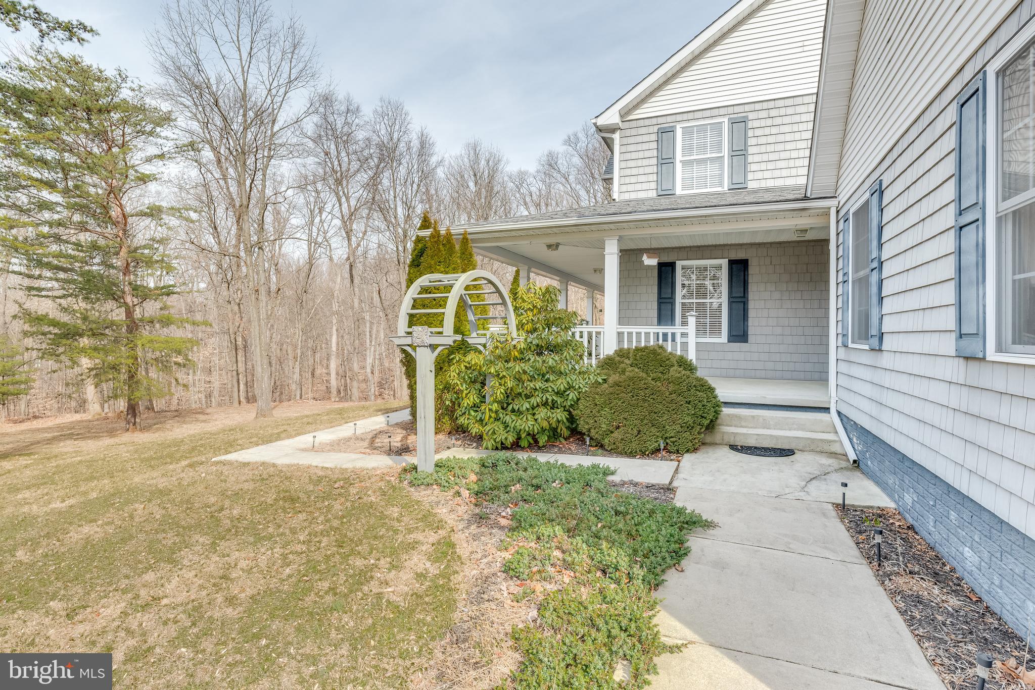 2439 Chestnut Grove Road Sharpsburg, MD 21782 - Photo 43 of 51 Exterior walkway around attached garage to house