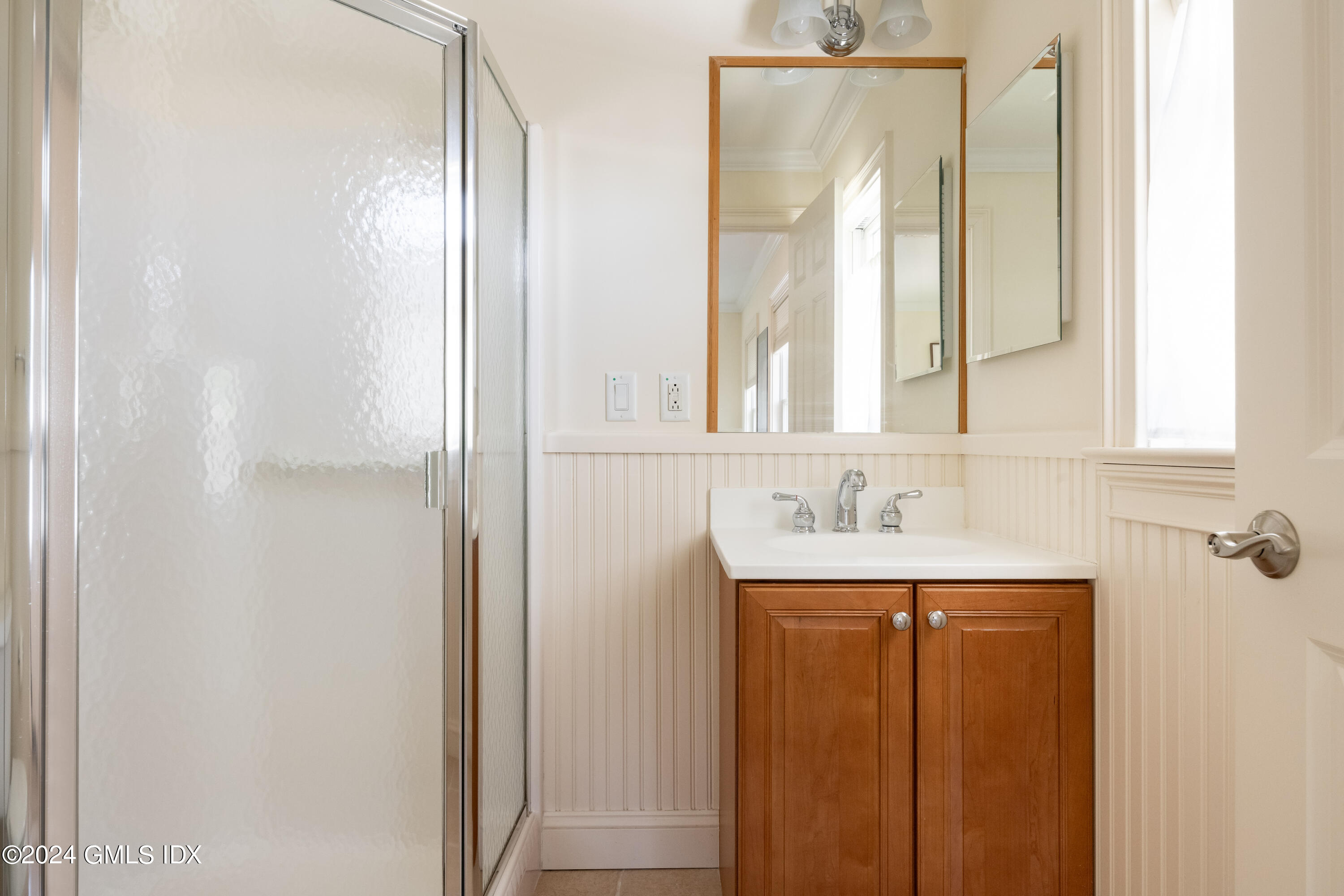54 Valley Road, Unit B Cos Cob, CT 06807 - Photo 14 of 22 a bathroom with a sink and a mirror