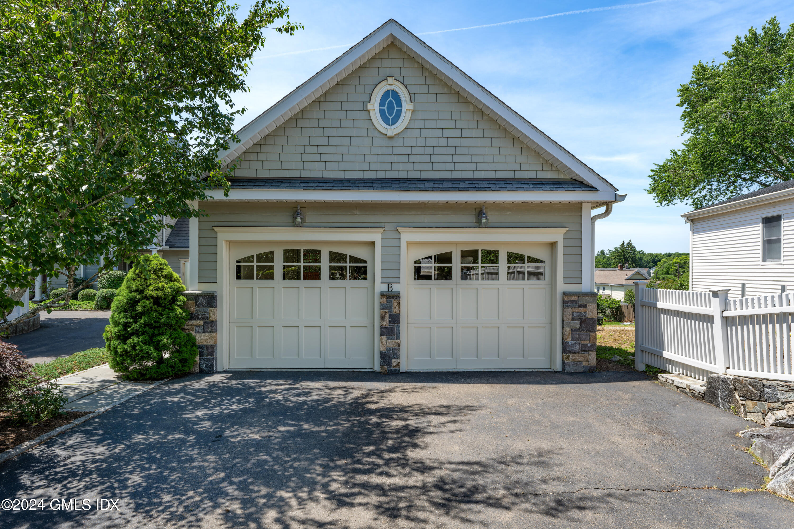54 Valley Road, Unit B Cos Cob, CT 06807 - Photo 19 of 22 a front view of a house with a yard
