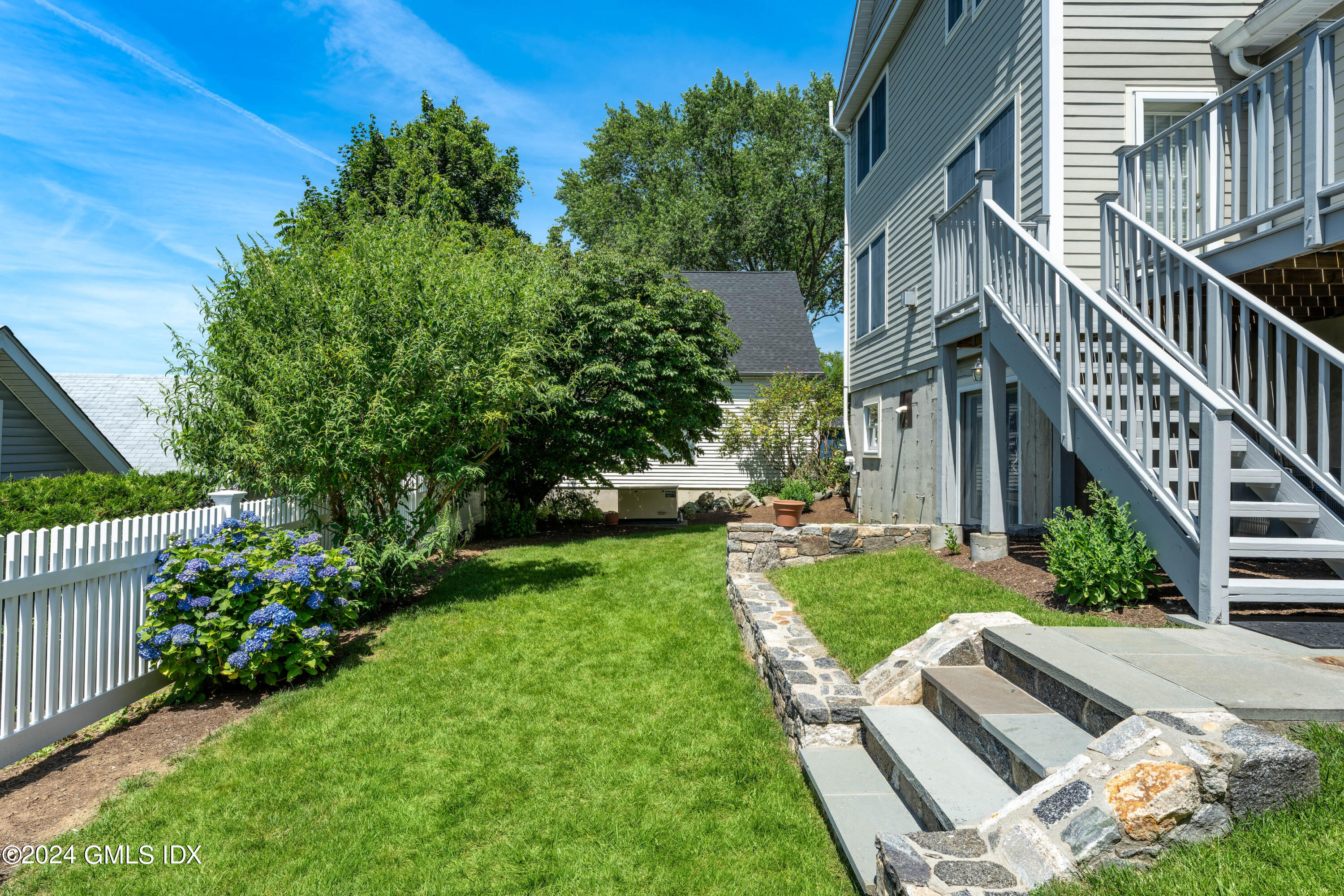 54 Valley Road, Unit B Cos Cob, CT 06807 - Photo 2 of 22 a view of an house with backyard and sitting area