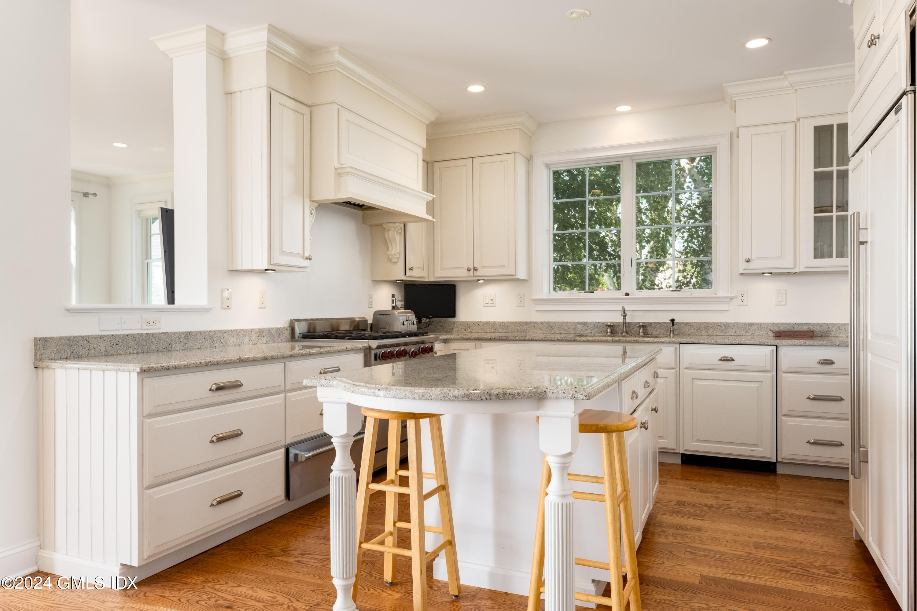 54 Valley Road, Unit B Cos Cob, CT 06807 - Photo 8 of 22 a kitchen with white cabinets and appliances