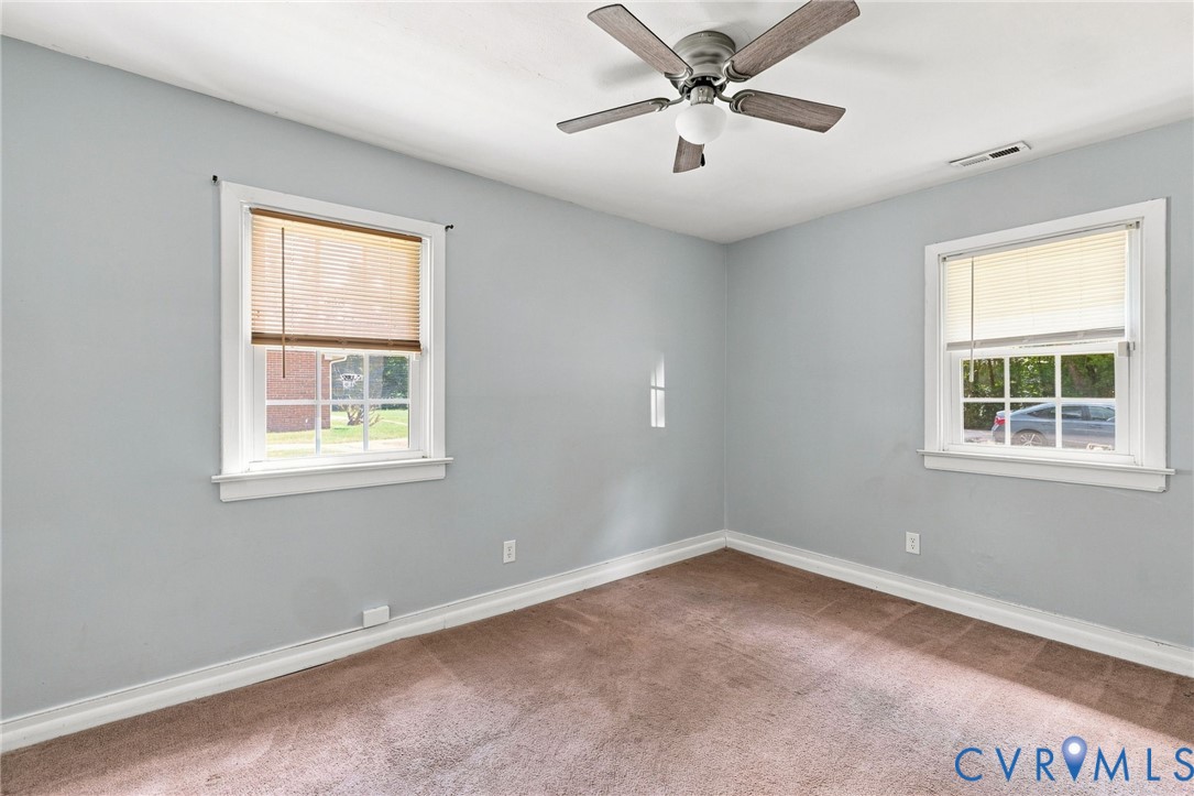 1700 Sizer Road Richmond, VA 23222 - Photo 12 of 16 Freshly painted bedroom with ceiling fan