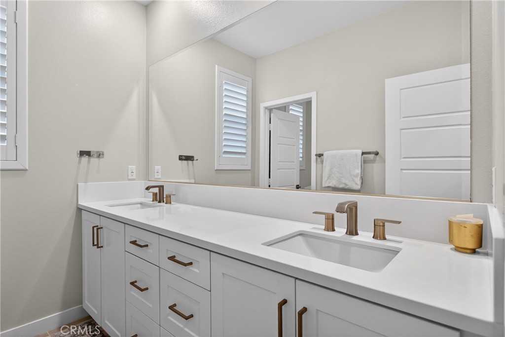 382 Chorus Irvine, CA 92618 - Photo 22 of 38 a bathroom with a sink and a mirror