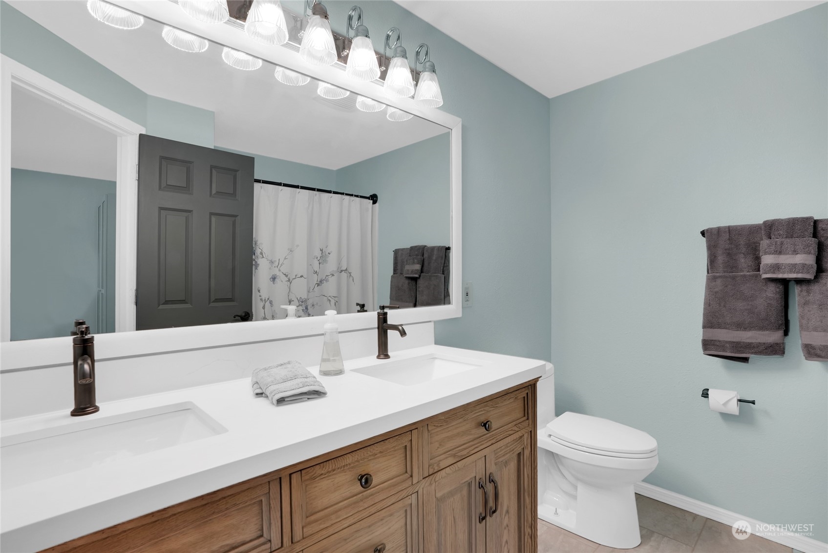 8110 Skinner Road Granite Falls, WA 98252 - Photo 13 of 30 a bathroom with a sink a toilet and mirror