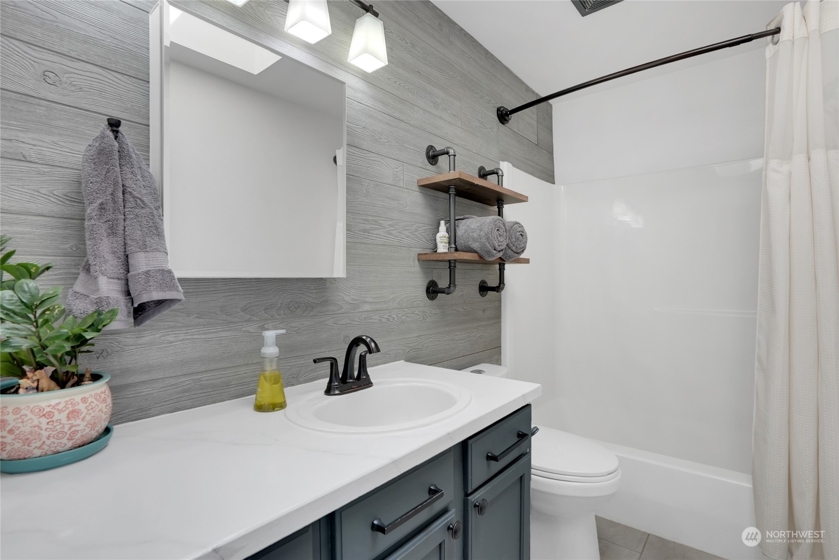 8110 Skinner Road Granite Falls, WA 98252 - Photo 15 of 30 a bathroom with a sink a toilet and shower