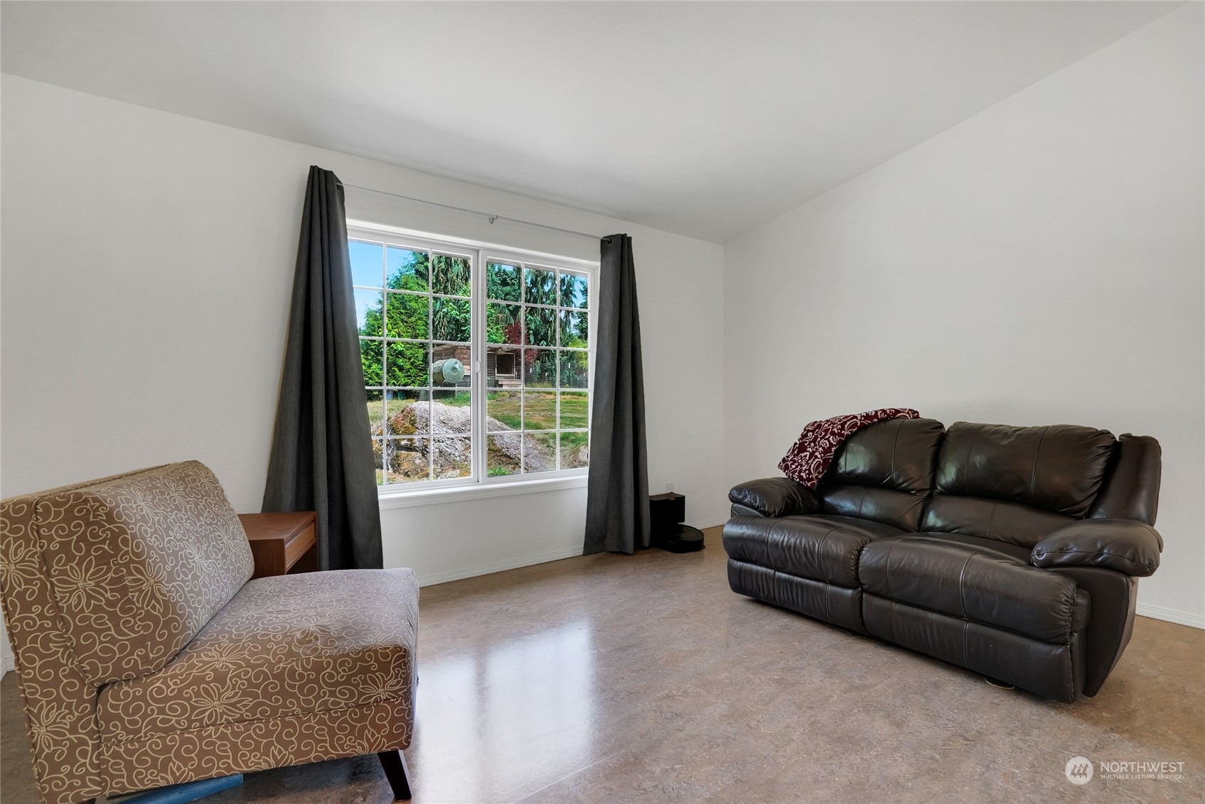 8110 Skinner Road Granite Falls, WA 98252 - Photo 3 of 30 a living room with furniture and a window