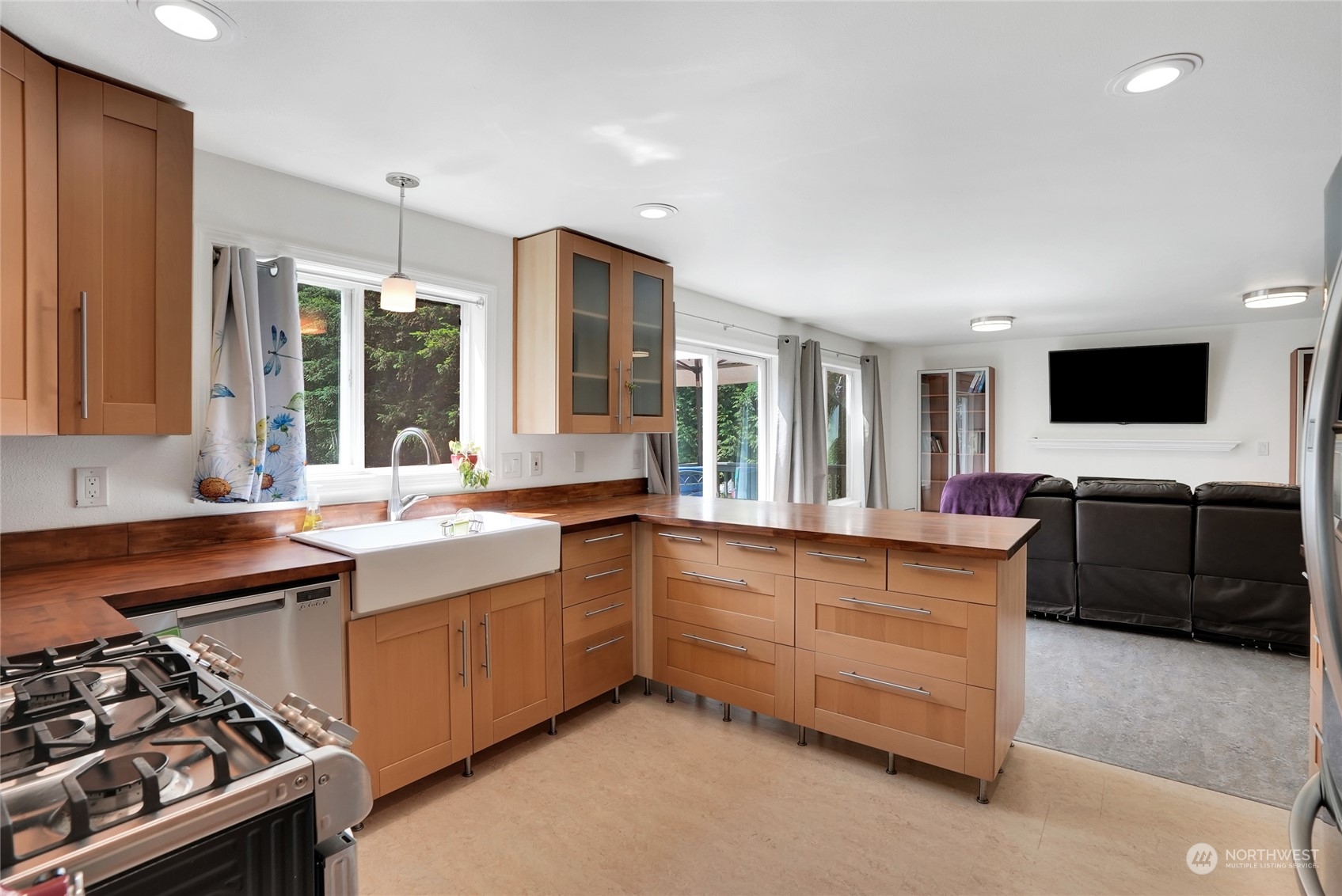 8110 Skinner Road Granite Falls, WA 98252 - Photo 6 of 30 a large kitchen with stainless steel appliances a sink and a stove