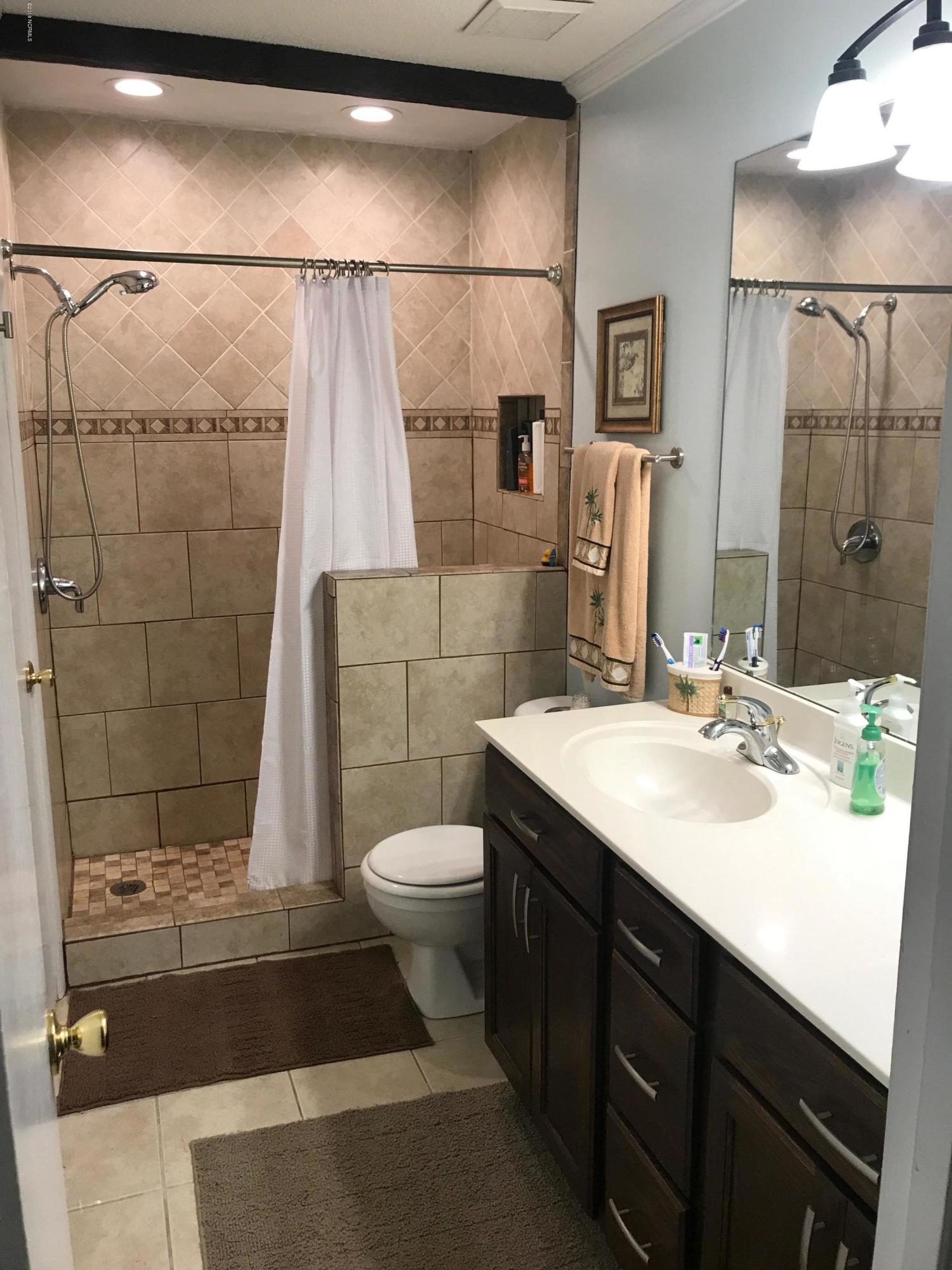 6058 Bethel Road Southeast Southport, NC 28461 - Photo 11 of 23 FULL BATH WITH WALK IN TILED SHOWER