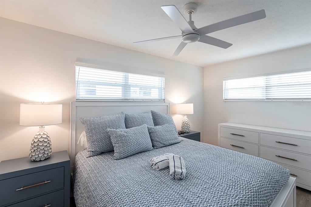 6020 Midnight Pass Road, Unit 5 Sarasota, FL 34242 - Photo 12 of 22 a bedroom with a bed and window
