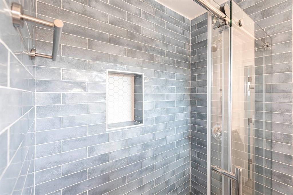 6020 Midnight Pass Road, Unit 5 Sarasota, FL 34242 - Photo 14 of 22 a bathroom with a shower