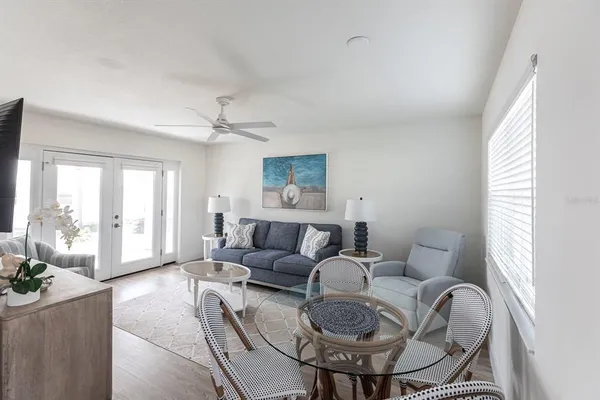 a living room with furniture and a large window