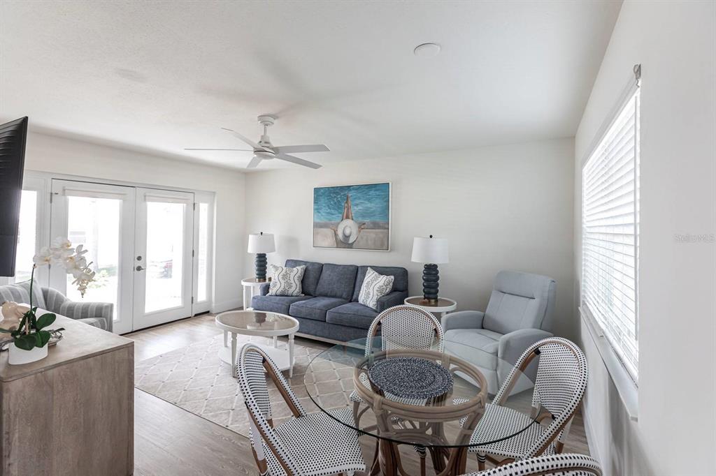 6020 Midnight Pass Road, Unit 5 Sarasota, FL 34242 - Photo 6 of 22 a living room with furniture and a large window
