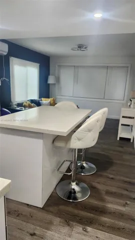 a room with furniture and a wooden floor