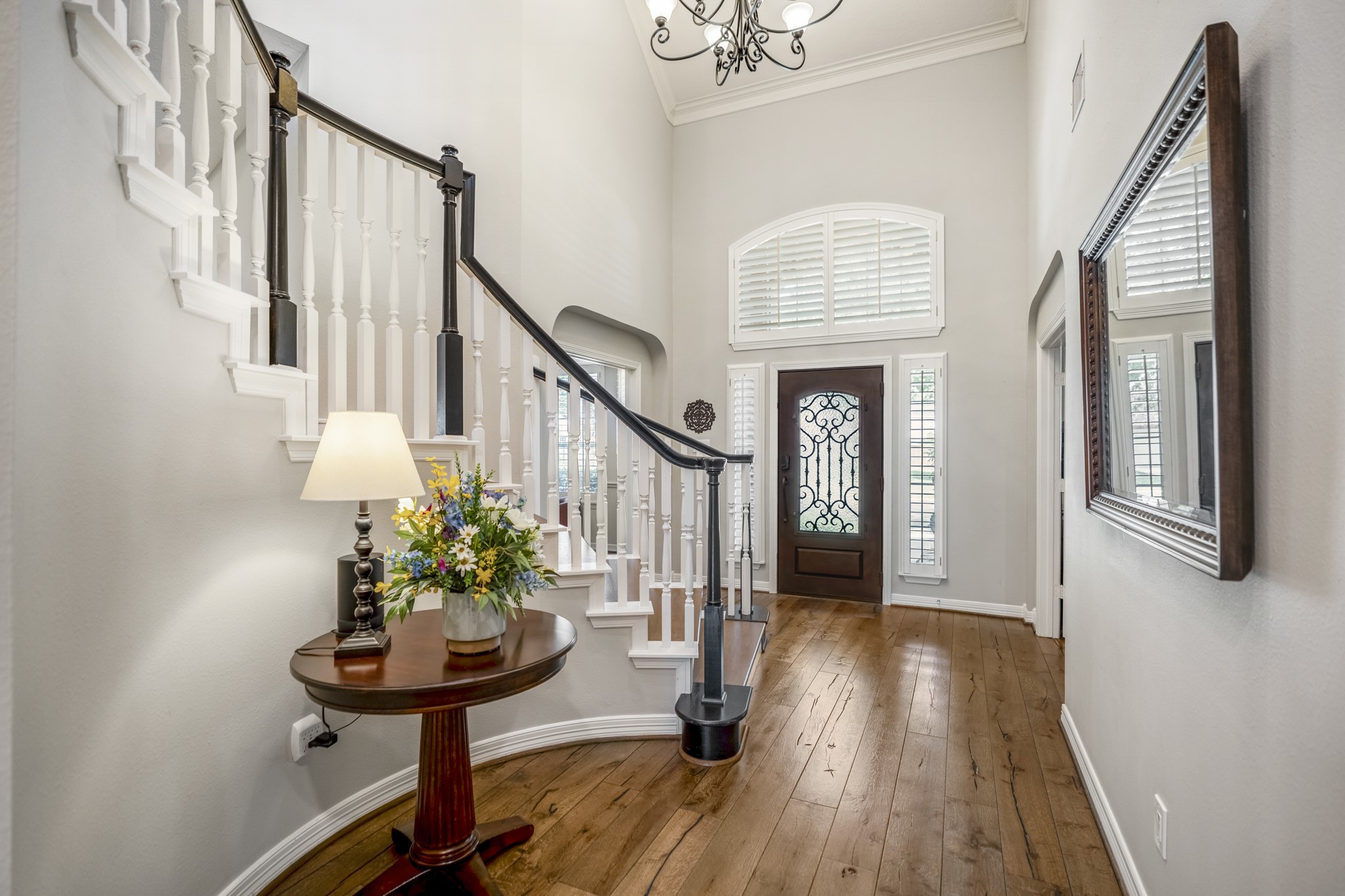 9707 Blue Cruls Way Spring, TX 77379 - Photo 12 of 50 a view of entryway with wooden floor and a chandelier