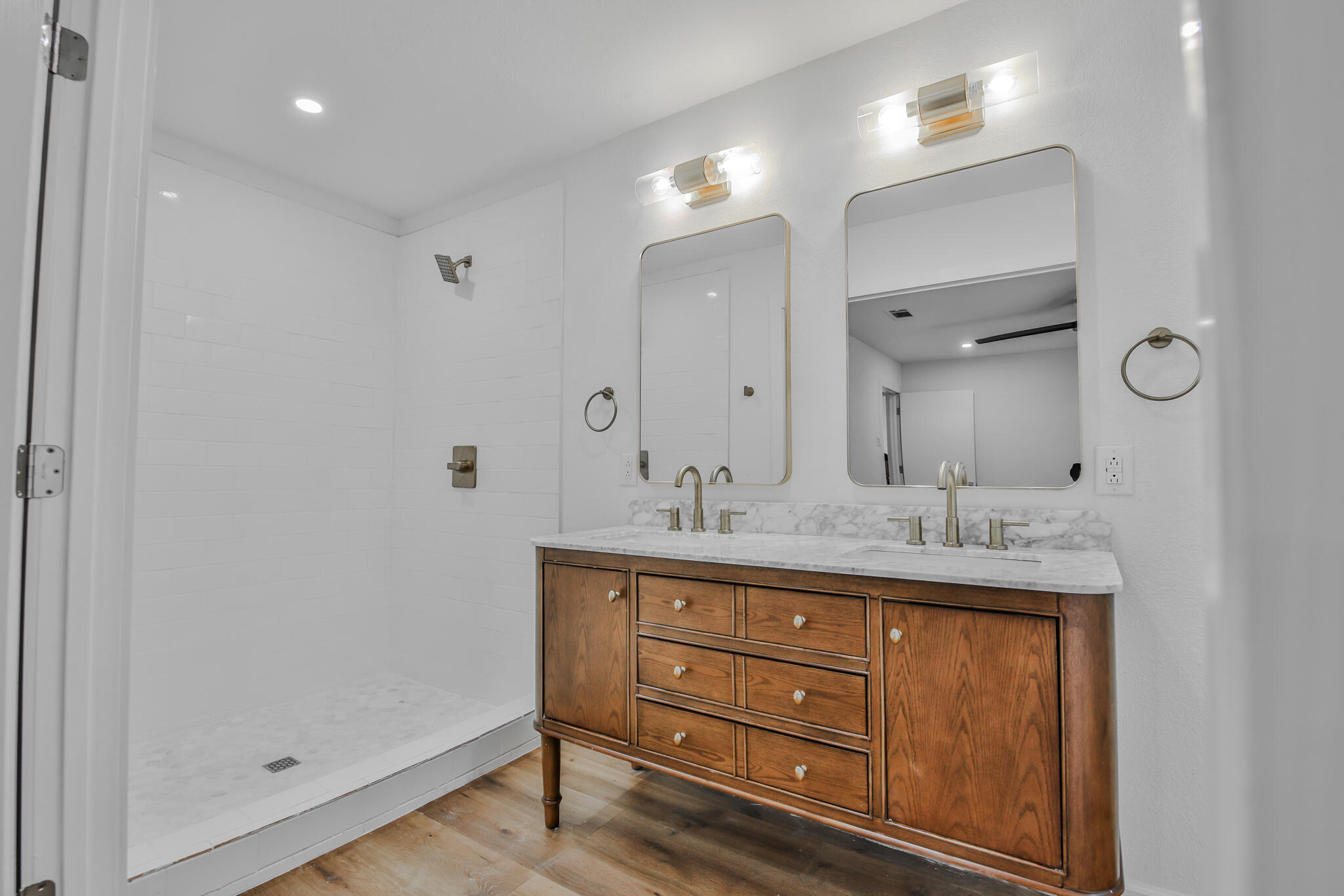 2620 78th Street Lubbock, TX 79423 - Photo 14 of 27 a bathroom with a granite countertop sink a mirror and a