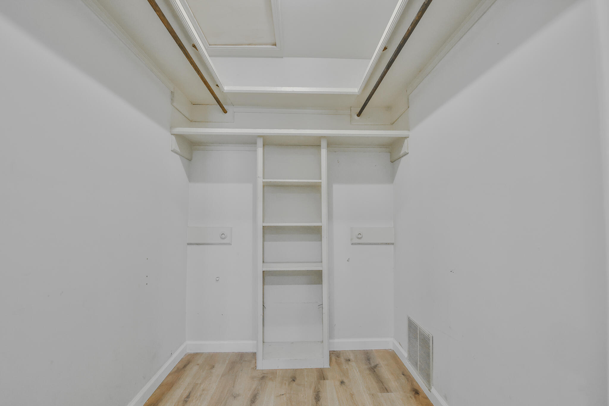 2620 78th Street Lubbock, TX 79423 - Photo 16 of 27 a view of walk in closet with empty racks