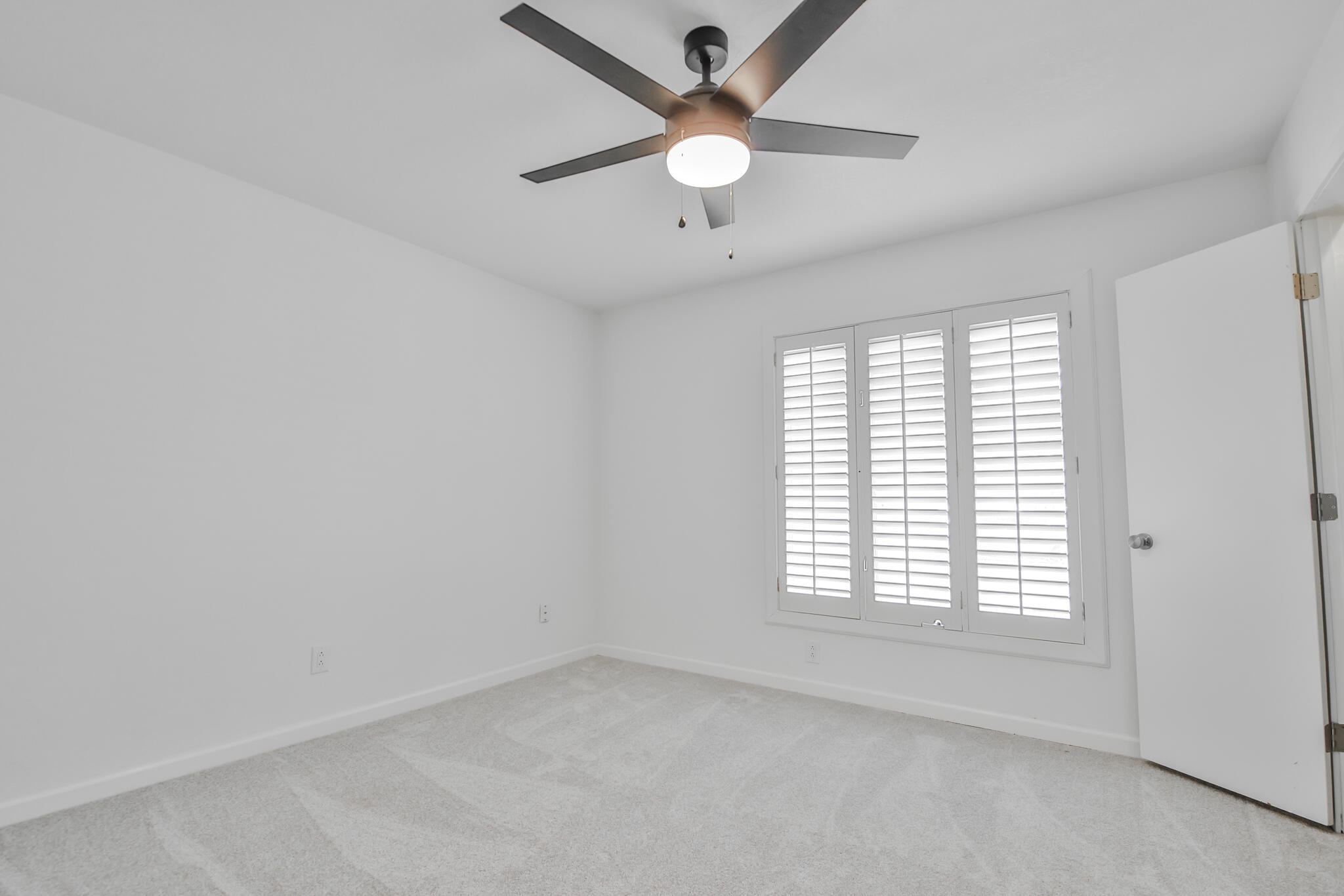 2620 78th Street Lubbock, TX 79423 - Photo 19 of 27 wooden floor in an empty room with a window