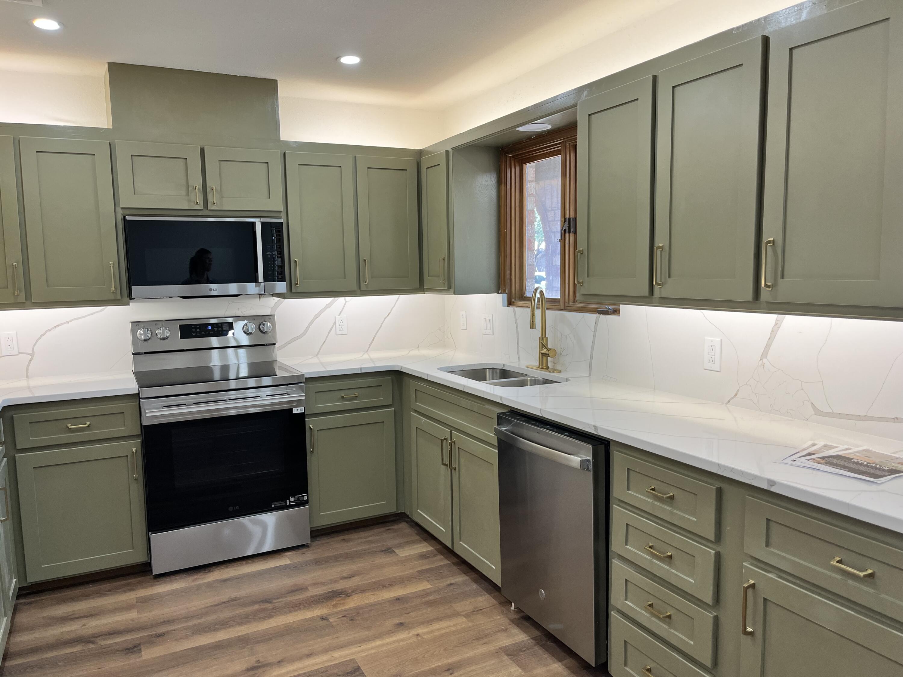 2620 78th Street Lubbock, TX 79423 - Photo 2 of 27 a kitchen with a sink and a stove top oven