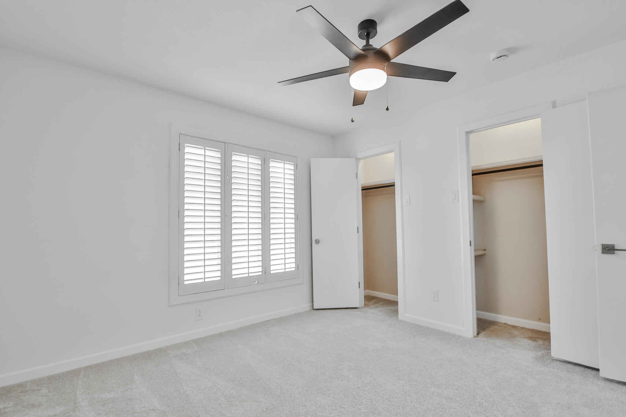 2620 78th Street Lubbock, TX 79423 - Photo 21 of 27 an empty room with fan and windows