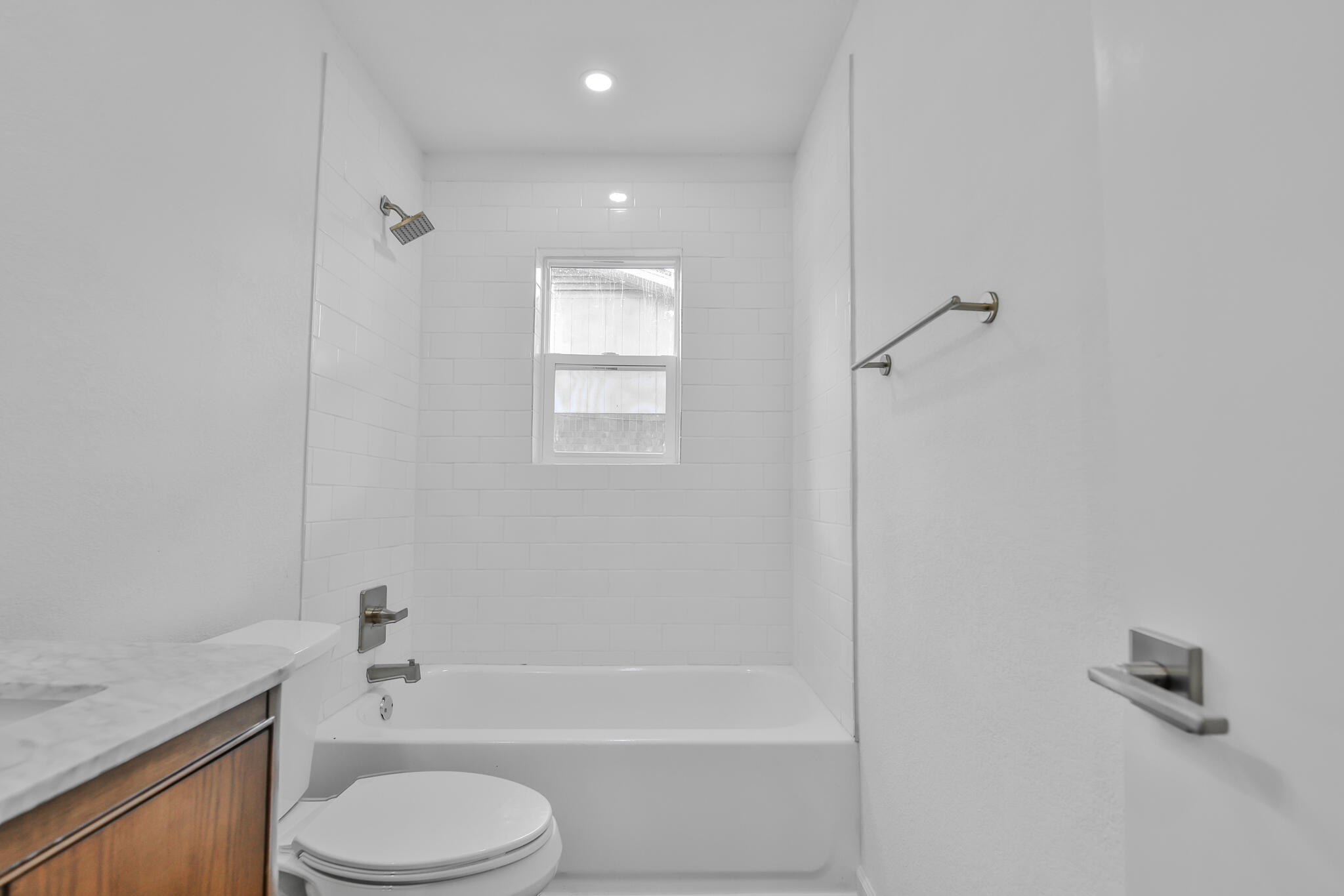 2620 78th Street Lubbock, TX 79423 - Photo 24 of 27 a bathroom with a granite countertop bathtub shower sink vanity and toilet