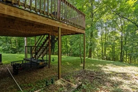 a view of a backyard with plants and a patio