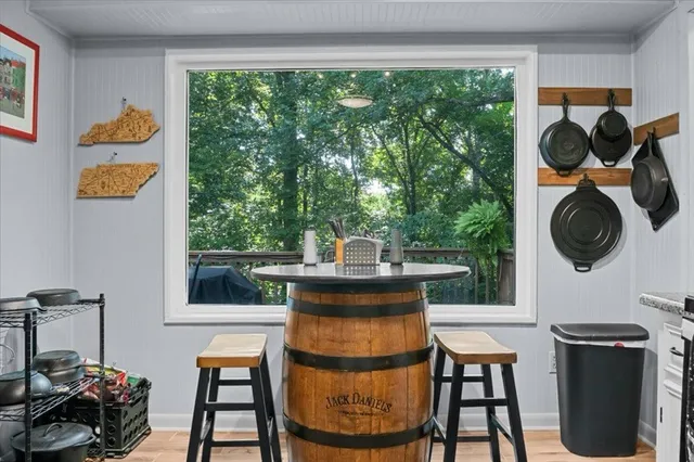a kitchen with a refrigerator and a sink