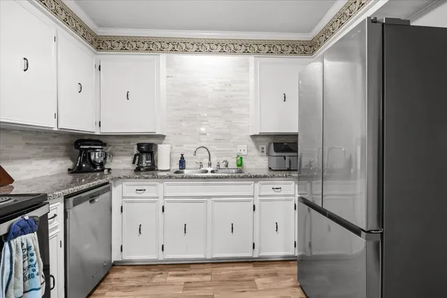 a bedroom with a bed and a television