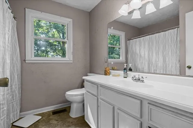 a bathroom with a bathtub and shower