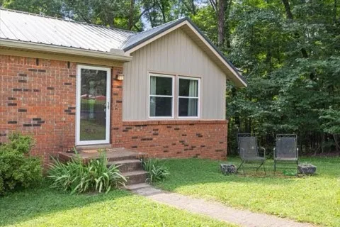 a front view of a house with garden
