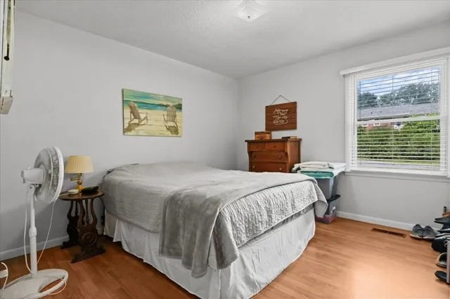 a bedroom with a bed and a dresser