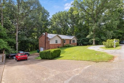 101 Cedar Hill Drive Waverly, TN 37185 - Photo 4 of 37 a house view with a car parked in front of it