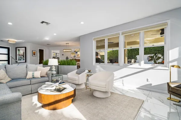 a kitchen with stainless steel appliances granite countertop a refrigerator and a stove