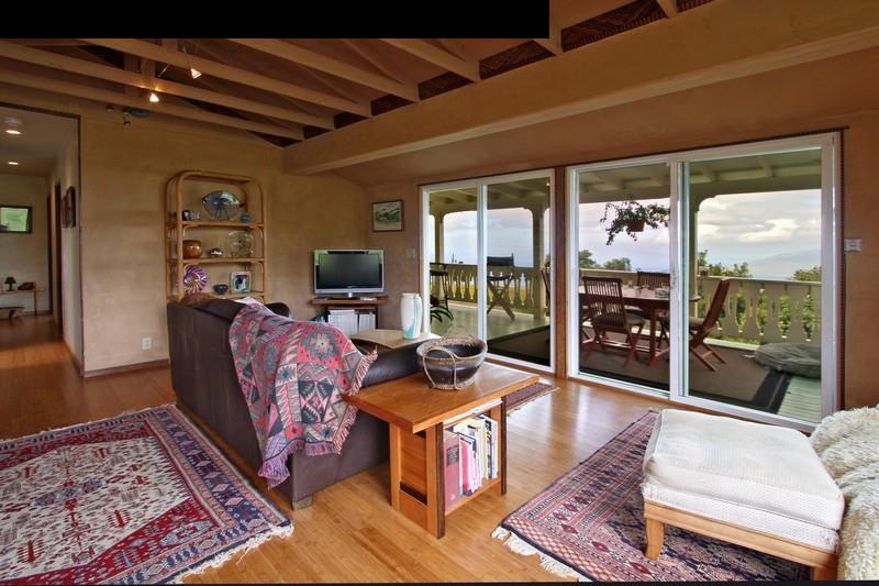 967 Polipoli Road Kula, HI 96790 - Photo 5 of 11 a living room with furniture and a floor to ceiling window